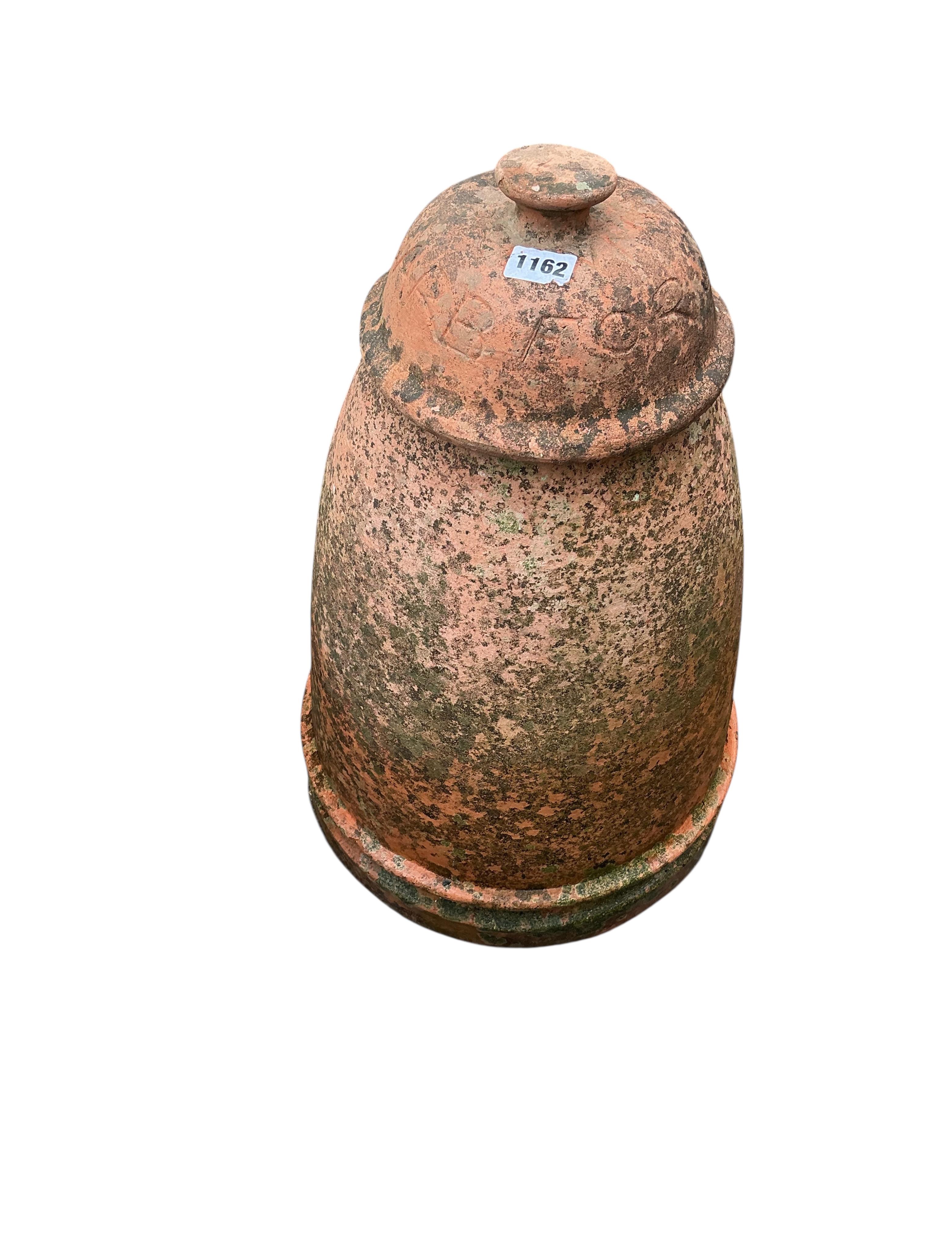 A circular terracotta rhubarb forcer and cover, height 54cm